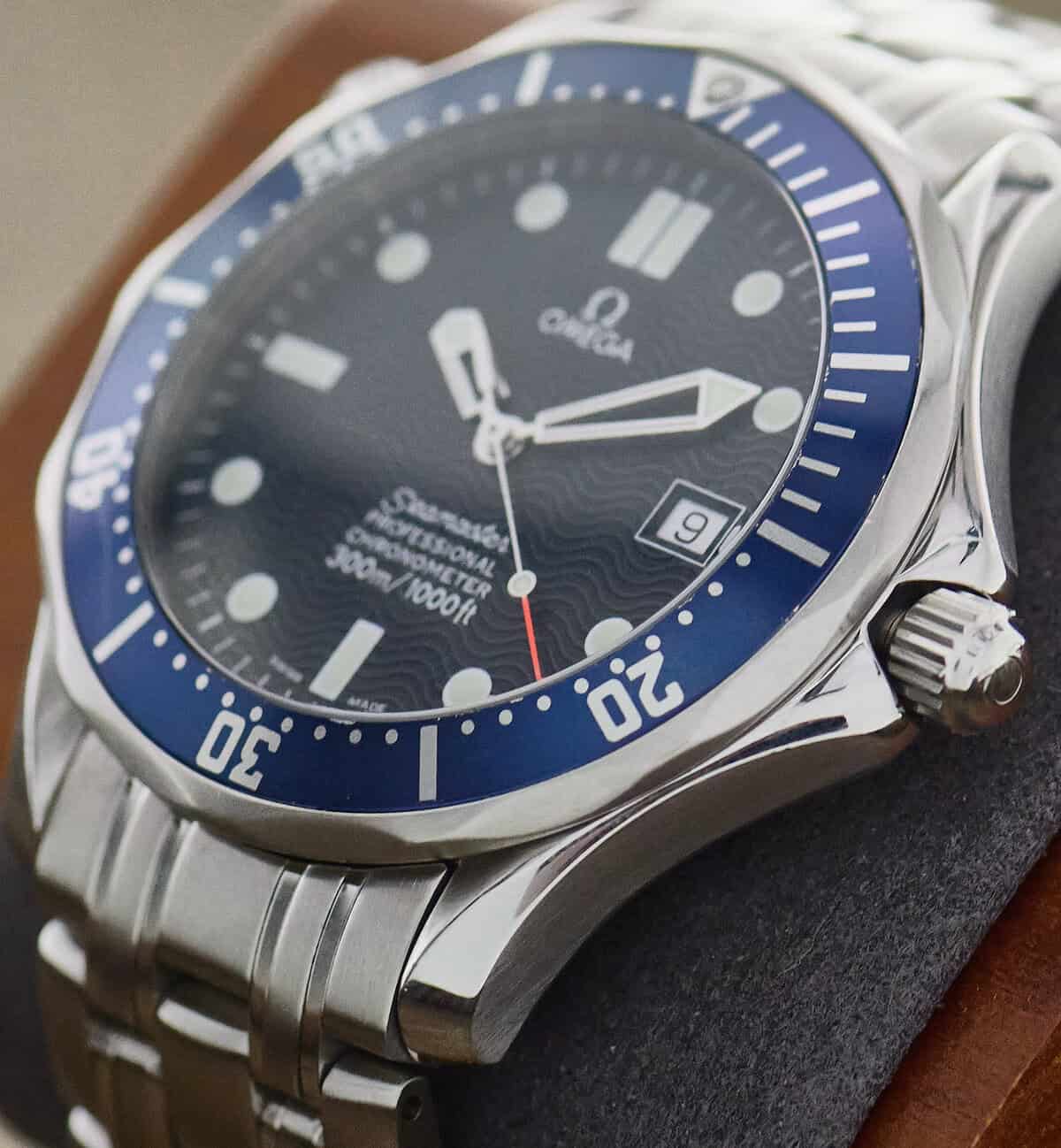 Close-up of a blue-dial Omega Seamaster Professional 300M 2531.80 showing the screw-down crown and steel bracelet.